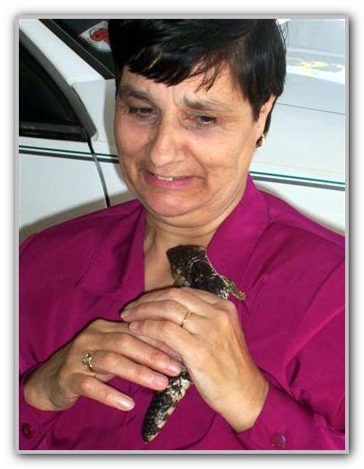 Mum holding MJ pet goanna